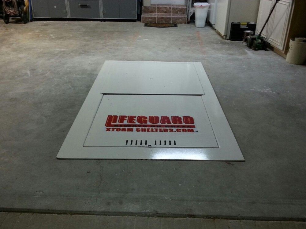 Stay safe in the event of a storm with this in-ground storm shelter installed in the floor of the garage. (Actual shelter not pictured, will provide photo of actual shelter soon. This is the same style of shelter.)